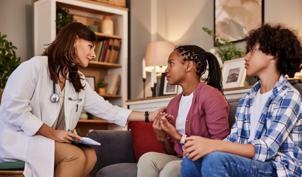 doctor-with-teen-and-adult-patient-in-home-2026-01-08-08-20-06-utc-scaled
