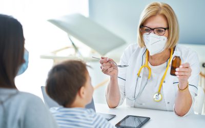 Pediatrician doctor examining little kids in clinic. High quality photo